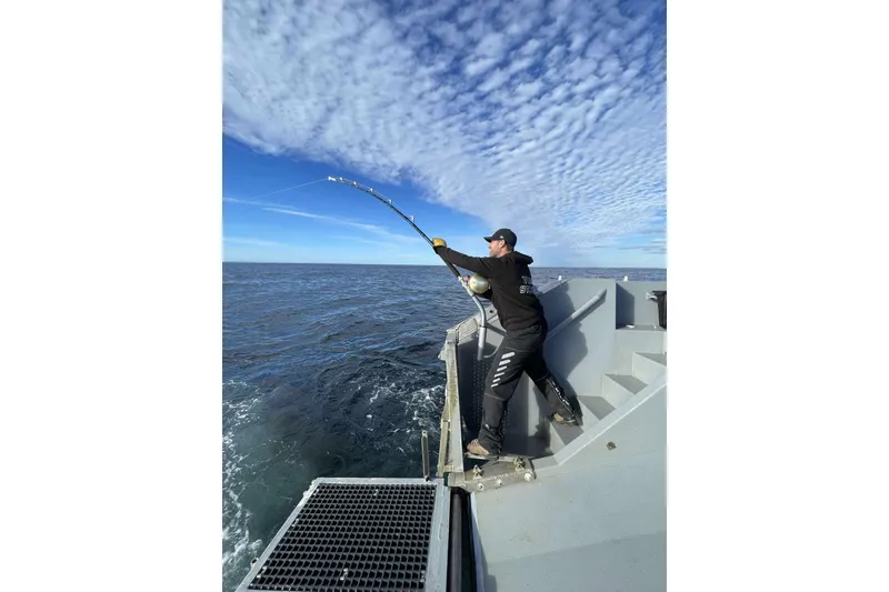 Slide: The Image of Person fishing on a 2012 River Hawk 73 Sea Stryker Fast Patrol Boat. - 32