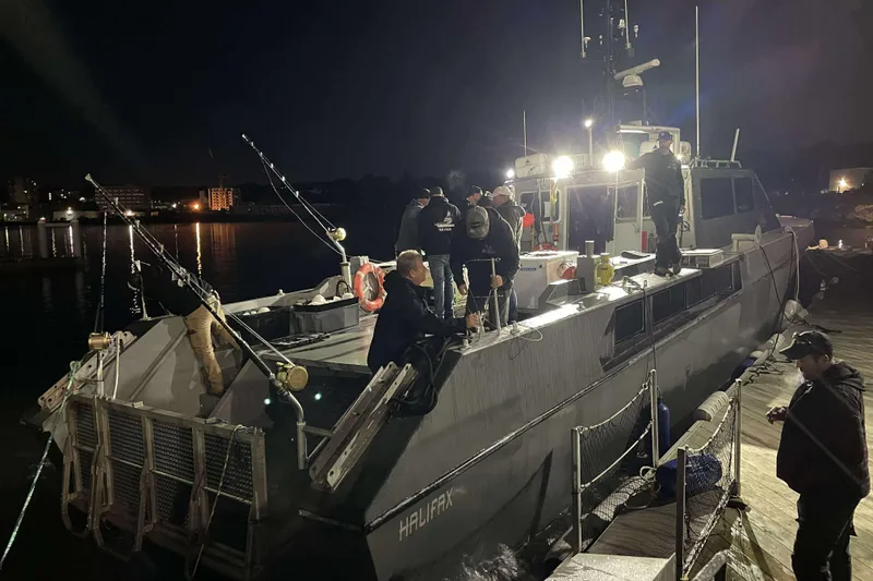 Slide: The Image of River Hawk 73 Sea Stryker Fast Patrol Boat docked at night, 2012 model. - 33