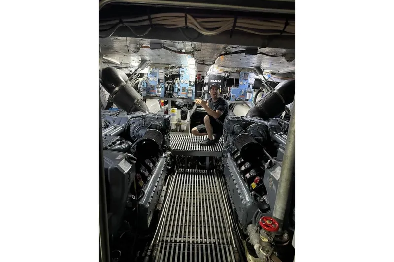 Slide: The Image of Engine room of 2012 River Hawk 73 Sea Stryker Fast Patrol Boat with technician. - 5
