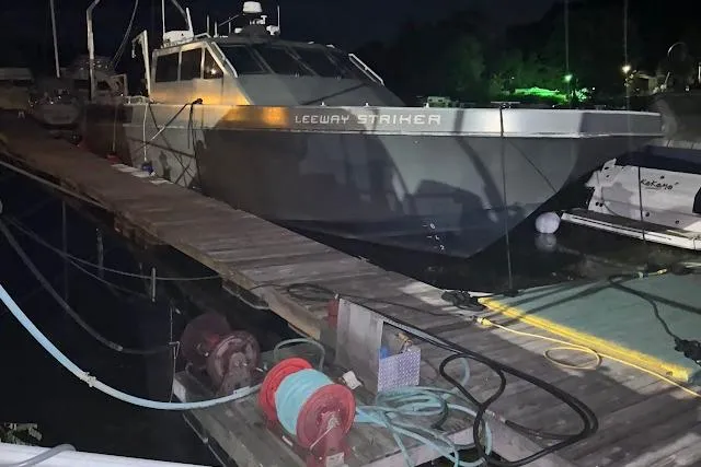 Slide: The Image of Riverhawk 73 Sea Stryker Fast Patrol Boat docked at night, 2012 model. - 6