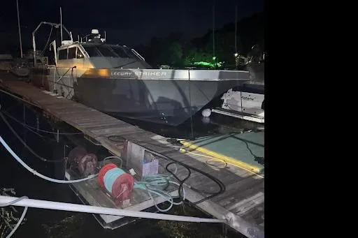 Slide: The Image of Riverhawk 73 Sea Stryker Fast Patrol Boat, 2012 model, docked at night. - 7