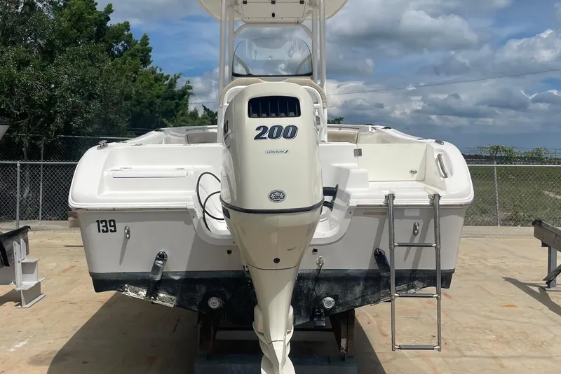 Slide: The Image of 2016 Sea Pro 219 Center Console boat with 200 HP engine, docked outdoors. - 10