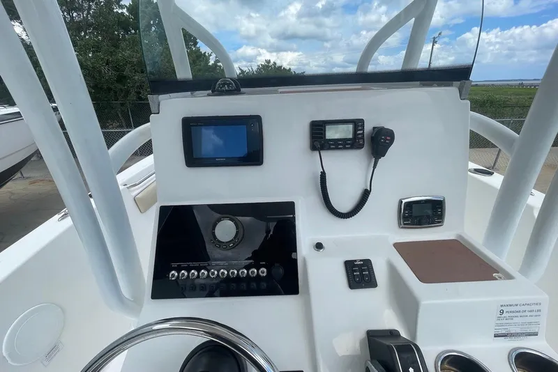 Slide: The Image of 2016 Sea Pro 219 Center Console dashboard with navigation and communication equipment. - 5