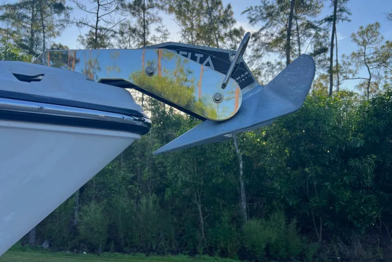 Slide: The Image of 2025 Monterey 255 Super Sport boat anchor detail against a forest backdrop. - 10