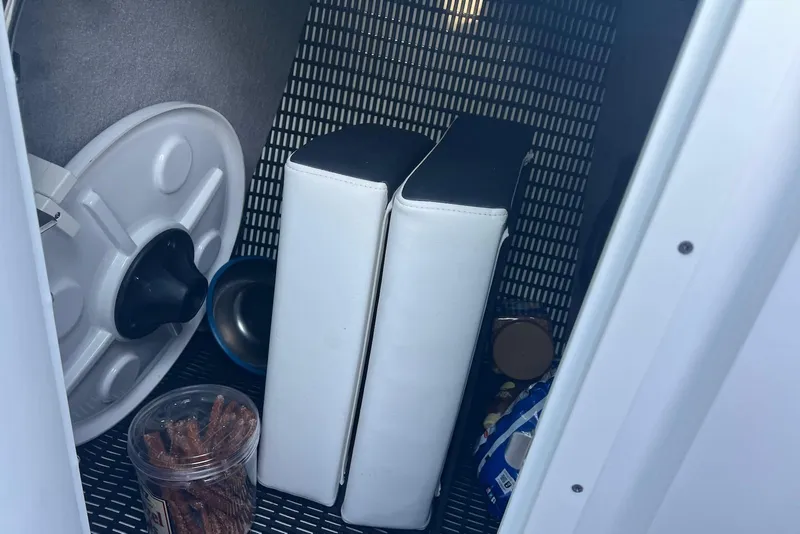 Slide: The Image of Storage compartment in 2025 Monterey 255 Super Sport boat with snacks and equipment. - 20