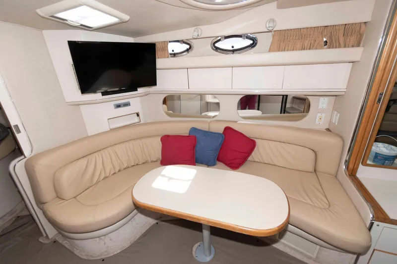 Slide: The Image of Luxurious interior of a 1995 Sea Ray 370 Sundancer yacht with seating and modern amenities. - 10