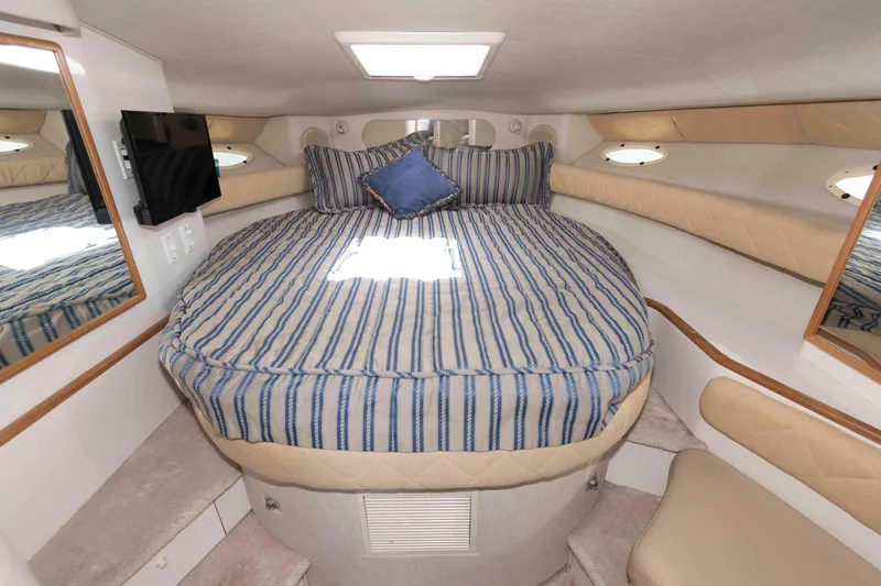 Slide: The Image of Interior of 1995 Sea Ray 370 Sundancer yacht kitchen with modern appliances and sleek cabinetry. - 11