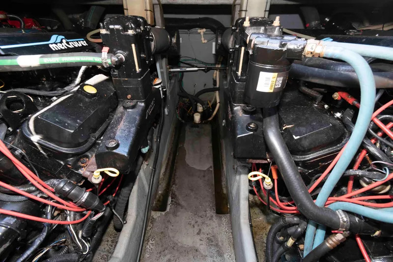 Slide: The Image of Interior of 1995 Sea Ray 370 Sundancer with beige seating and wooden cabinetry. - 14