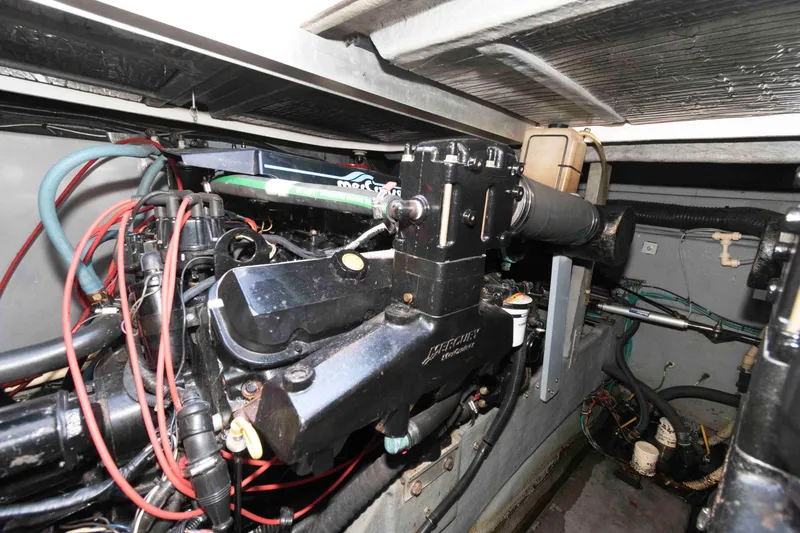 Slide: The Image of 1995 Sea Ray 370 Sundancer bathroom with toilet, sink, and shower area. - 15