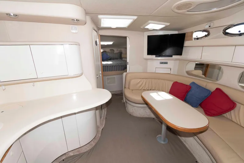 Slide: The Image of Cockpit of 1995 Sea Ray 370 Sundancer with steering wheel and control panel. - 8