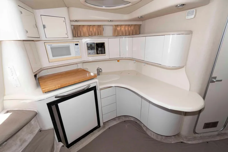 Slide: The Image of Cockpit view of 1995 Sea Ray 370 Sundancer with steering wheel and control panel. - 9