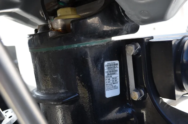 Slide: The Image of Close-up of a 2018 Chaparral 250 Suncoast engine component with visible serial number label. - 12