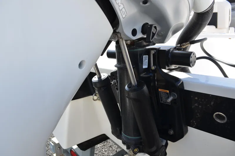 Slide: The Image of Close-up of 2018 Chaparral 250 Suncoast boat engine components and hydraulic system. - 13