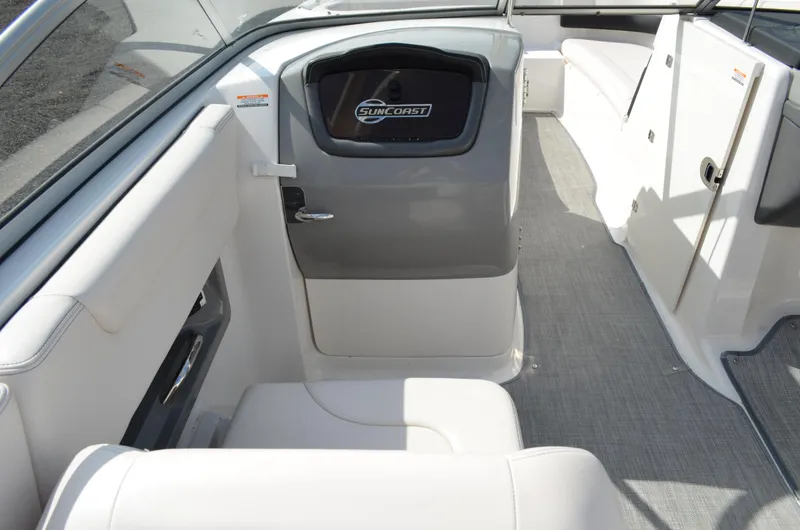 Slide: The Image of 2018 Chaparral 250 Suncoast boat interior with seating and Suncoast branding. - 23