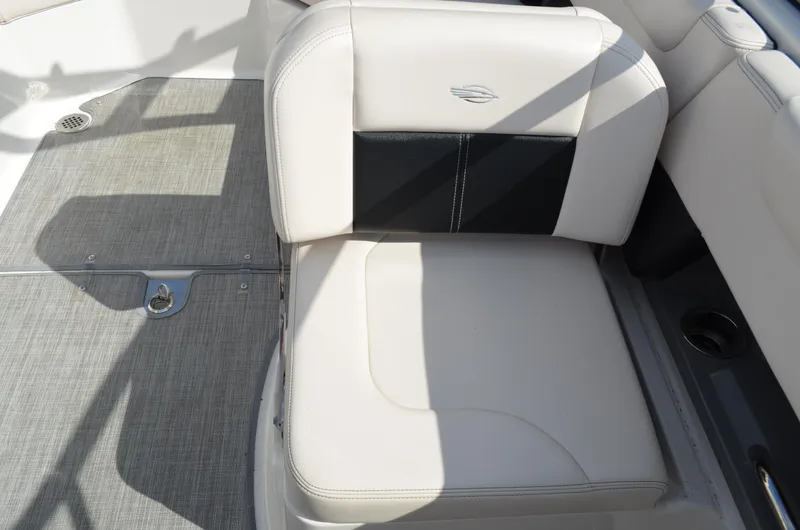 Slide: The Image of 2018 Chaparral 250 Suncoast boat seat with beige upholstery and black accent. - 25