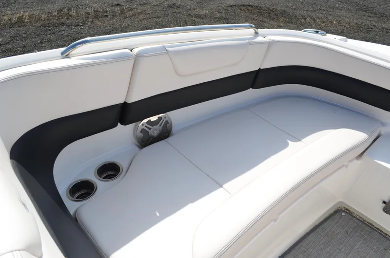 Slide: The Image of 2018 Chaparral 250 Suncoast boat interior with white seating and cup holders. - 40