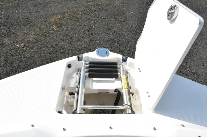 Slide: The Image of 2018 Chaparral 250 Suncoast boat anchor compartment with open hatch. - 42