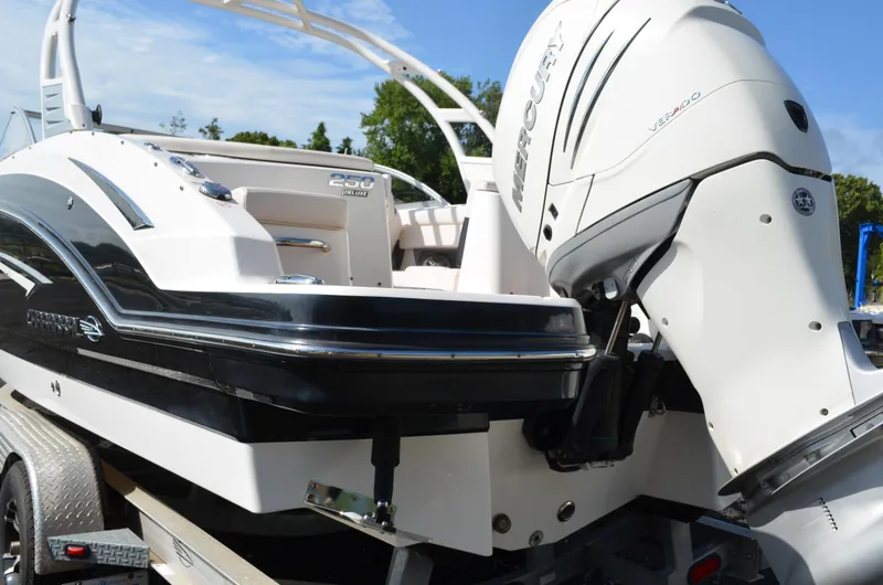 Slide: The Image of 2018 Chaparral 250 Suncoast boat with Mercury Verado engine on trailer. - 8