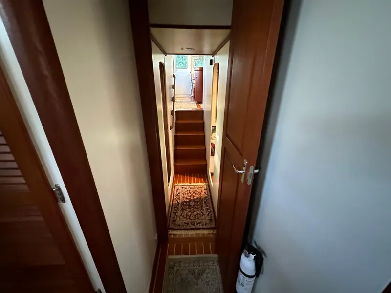 Slide: The Image of Interior of 2001 Cherubini Independence 45 yacht with nautical decor and cozy seating area. - 15