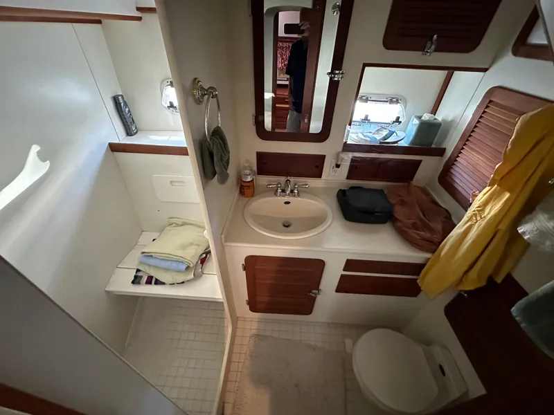 Slide: The Image of Luxurious cabin interior of 2001 Cherubini Independence 45 yacht with cozy bed and elegant wood finish. - 17