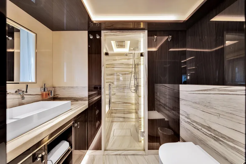 Slide: The Image of Luxurious bathroom interior on 2021 Sirena 88 yacht, featuring elegant marble and modern fixtures. - 121