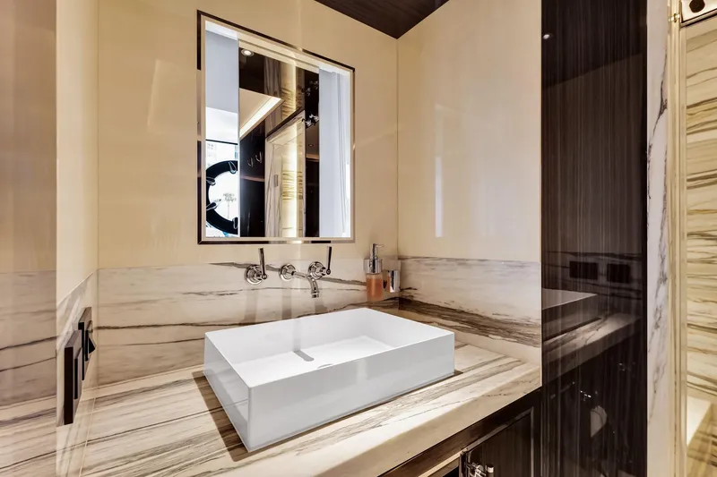 Slide: The Image of Luxurious bathroom in 2021 Sirena 88 yacht with modern sink and elegant marble accents. - 122