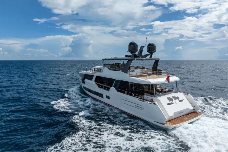Slide: The Image of Luxury Sirena 88 yacht cruising on open sea, 2021 model, under a partly cloudy sky. - 144
