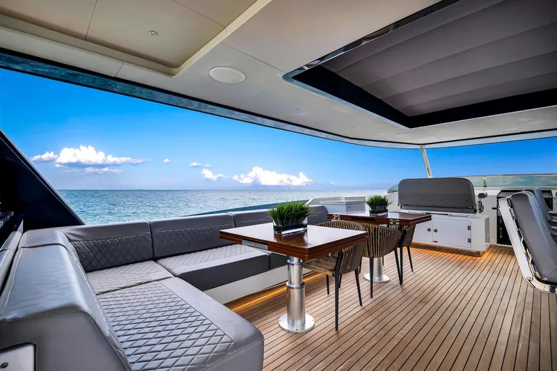 Slide: The Image of Luxurious 2021 Sirena 88 yacht deck with elegant seating and ocean view. - 17