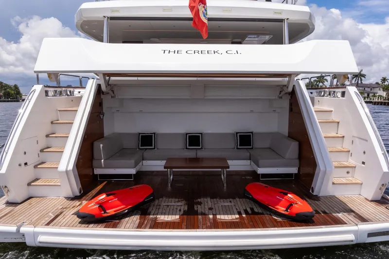 Slide: The Image of Luxury Sirena 88 yacht deck with seating, stairs, and water sports equipment, 2021 model. - 41