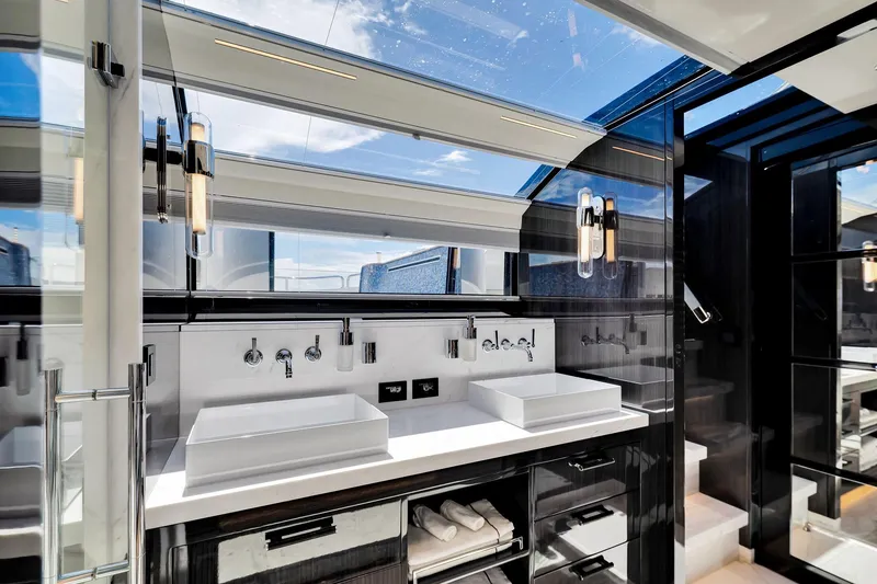 Slide: The Image of Luxurious bathroom interior on 2021 Sirena 88 yacht, featuring dual sinks and modern fixtures. - 84