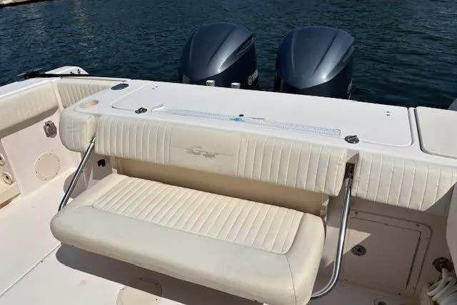 Slide: The Image of 2011 Grady-White Canyon 306 boat with dual engines and cushioned seating. - 5