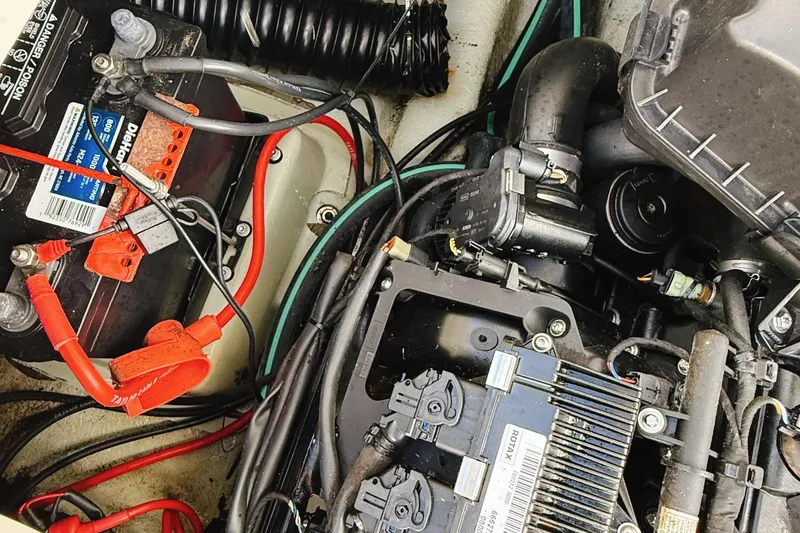 Slide: The Image of Engine compartment of 2010 Seadoo 210 Challenger SE with visible battery and wiring. - 14