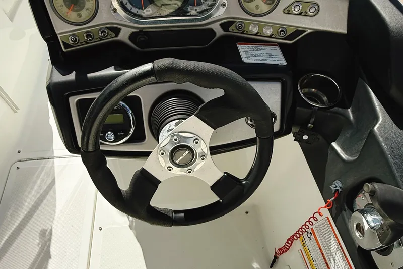 Slide: The Image of Steering wheel and dashboard of 2010 Seadoo 210 Challenger SE boat. - 17