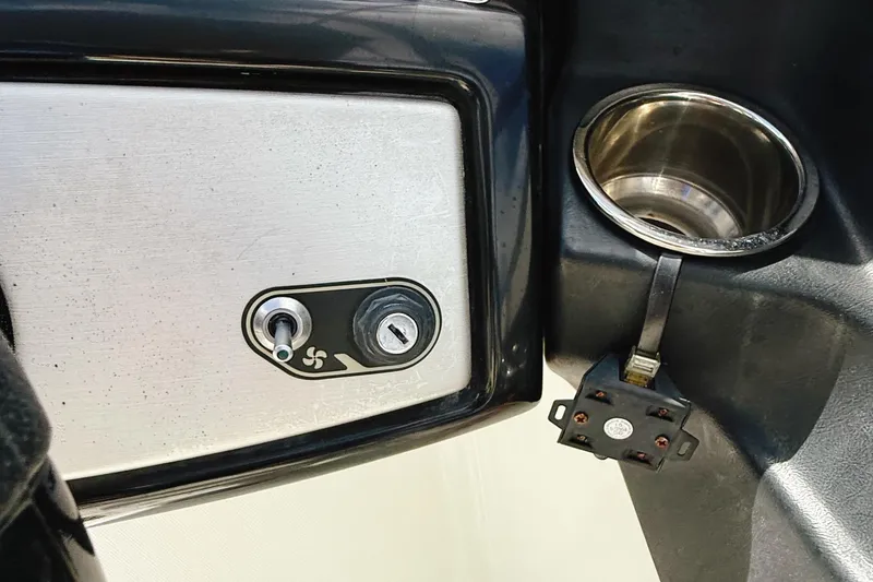 Slide: The Image of 2010 Seadoo 210 Challenger SE dashboard with ignition switch and cup holder. - 20