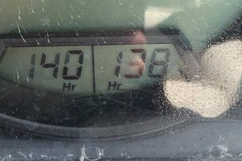 Slide: The Image of Dashboard display of 2010 Seadoo 210 Challenger SE showing 140 and 138 hours. - 23