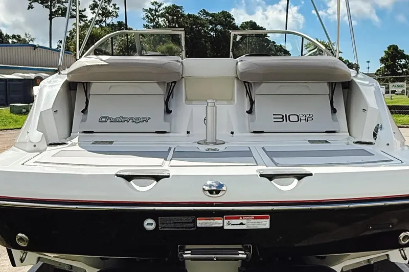 Slide: The Image of 2010 Seadoo 210 Challenger SE boat rear view, featuring 310 HP Rotax engine. - 3