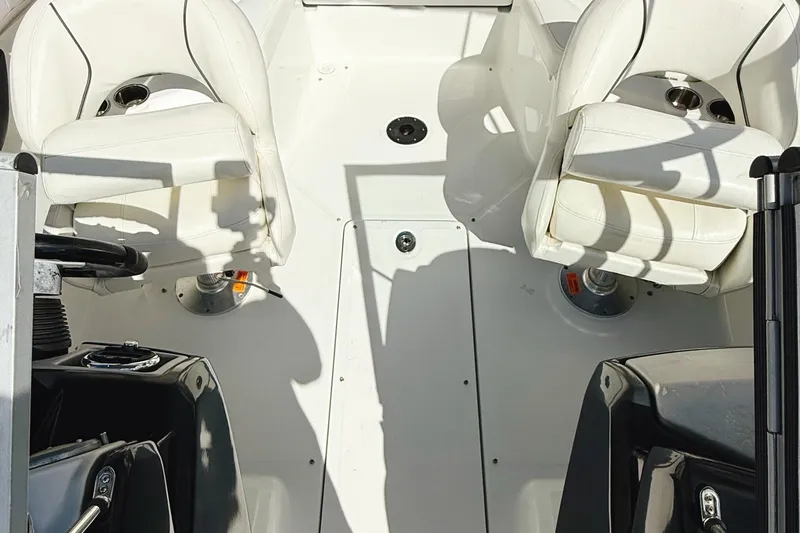 Slide: The Image of 2010 Seadoo 210 Challenger SE interior with white seating and steering console. - 6