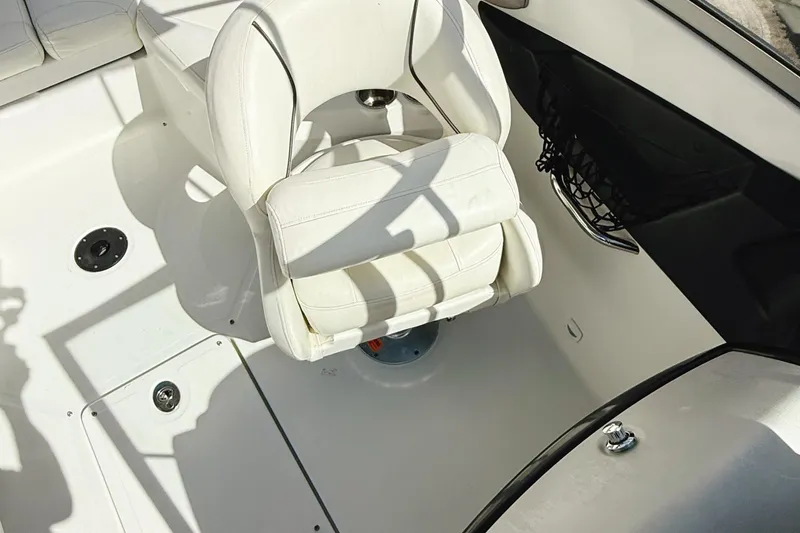 Slide: The Image of 2010 Seadoo 210 Challenger SE interior with white seating and sleek design. - 7