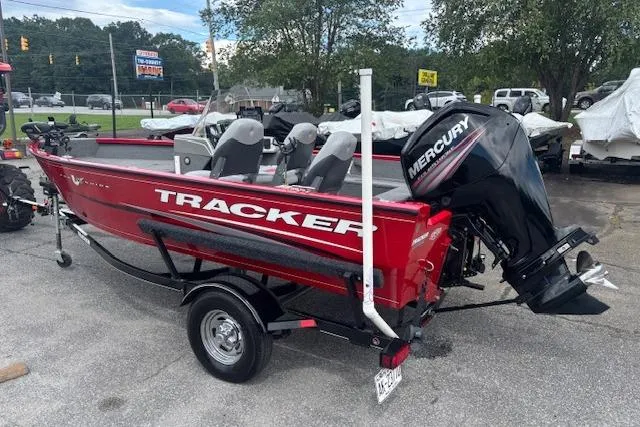 Slide: The Image of 2016 Tracker Pro Guide V-16 SC boat with Mercury engine on trailer. - 3