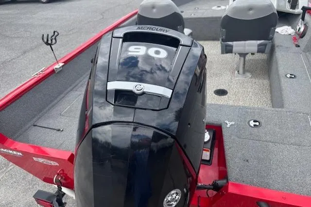 Slide: The Image of 2016 Tracker Pro Guide V-16 SC boat with Mercury 90 engine, red and gray interior. - 5