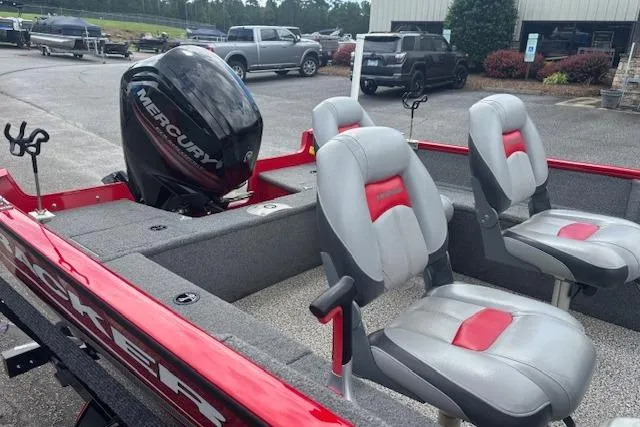 Slide: The Image of 2016 Tracker Pro Guide V-16 SC boat with Mercury engine, featuring gray and red seating. - 8