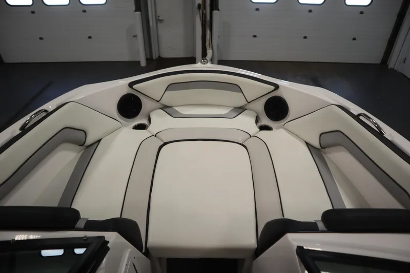Slide: The Image of 2018 Yamaha AR195 boat interior with white cushioned seating and speakers. - 11