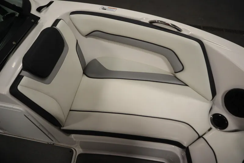 Slide: The Image of 2018 Yamaha AR195 boat interior seating with white and gray upholstery. - 14