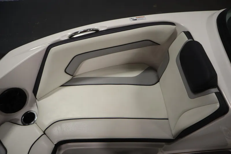 Slide: The Image of 2018 Yamaha AR195 boat interior seating with cup holder and speaker. - 16