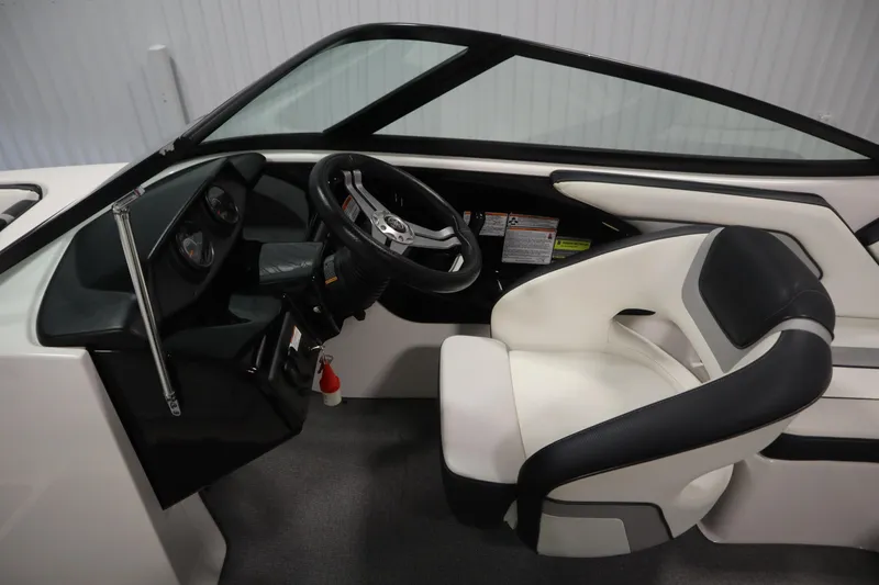 Slide: The Image of 2018 Yamaha AR195 boat interior with steering wheel and captain's seat. - 18
