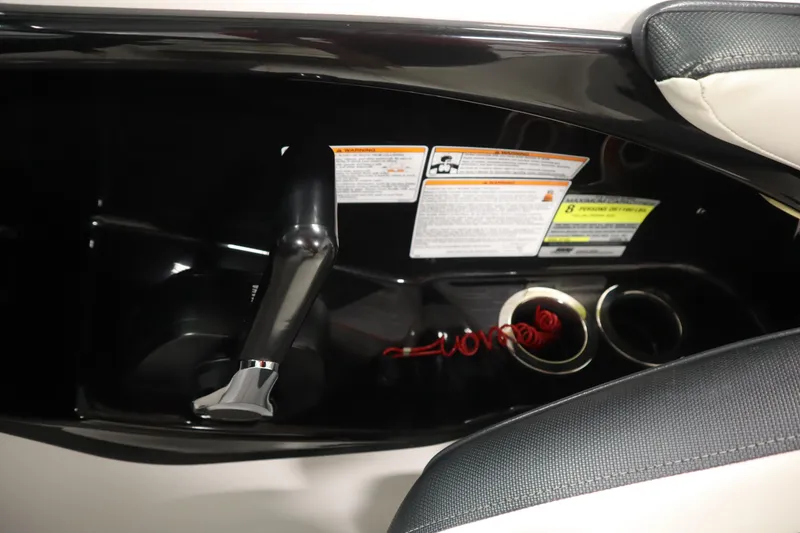 Slide: The Image of 2018 Yamaha AR195 boat interior with throttle control and cup holders. - 24