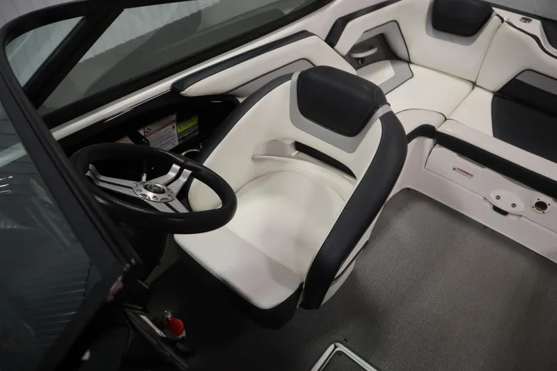 Slide: The Image of 2018 Yamaha Boats AR195 interior with steering wheel and seating. - 26