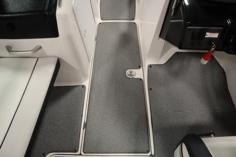 Slide: The Image of 2018 Yamaha AR195 boat interior with gray carpet and seating. - 28