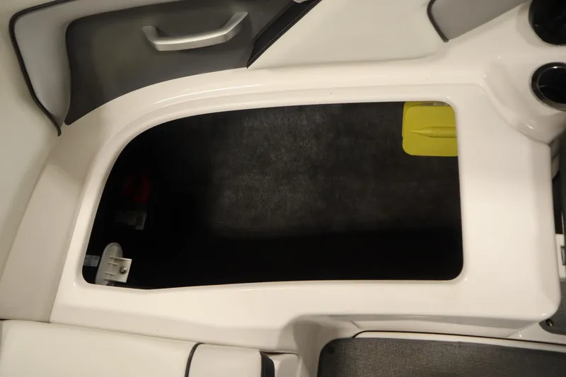 Slide: The Image of 2018 Yamaha AR195 boat storage compartment with gray and white interior. - 37