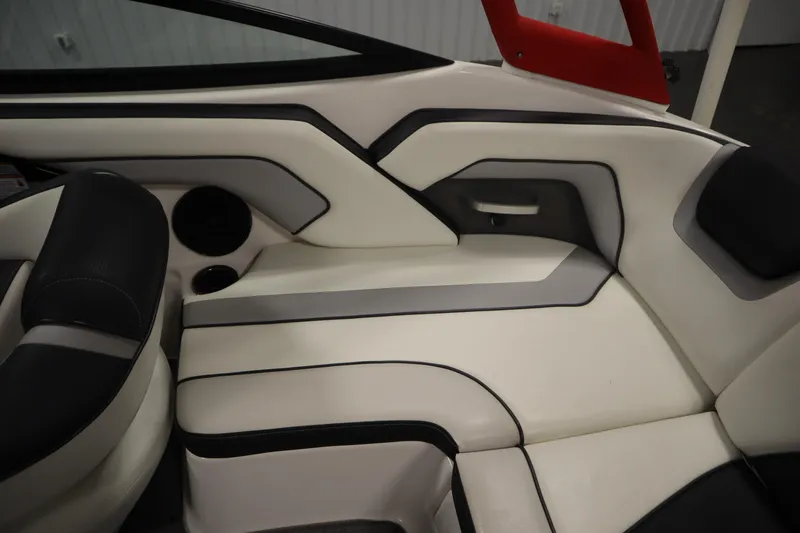 Slide: The Image of Interior seating of a 2018 Yamaha AR195 boat, featuring sleek white and black upholstery. - 41